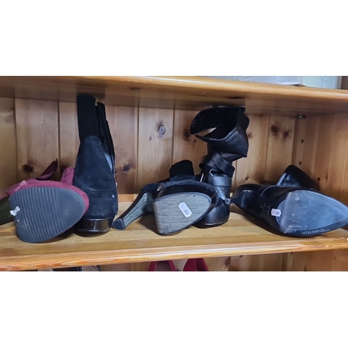 615 - Collection of three new or as new  ankle boots: red suede, black suede, and black leather with buckl... 