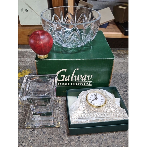 628 - An As new Galway Irish Crystal set includes a cut crystal bowl, clock, and square vase, all marked.