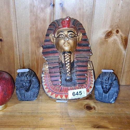 645 - Egyptian-themed set featuring a large Sphinx bust and two smaller sculptures, showcasing intricate d... 