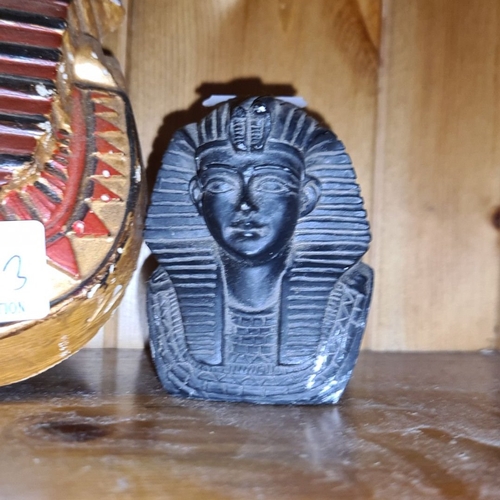 645 - Egyptian-themed set featuring a large Sphinx bust and two smaller sculptures, showcasing intricate d... 