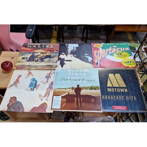 659 - Vinyl record lot featuring albums: “Malibu,” “Spartacus,” “Buena Vista Social Club,” “Crop Crop,” an... 