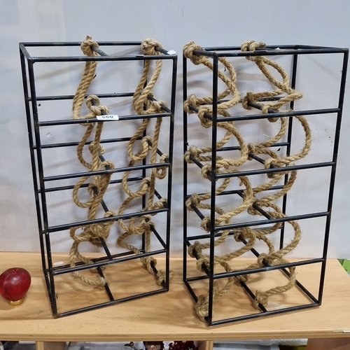 660 - Pair of industrial-style metal wine racks with decorative rope detail.