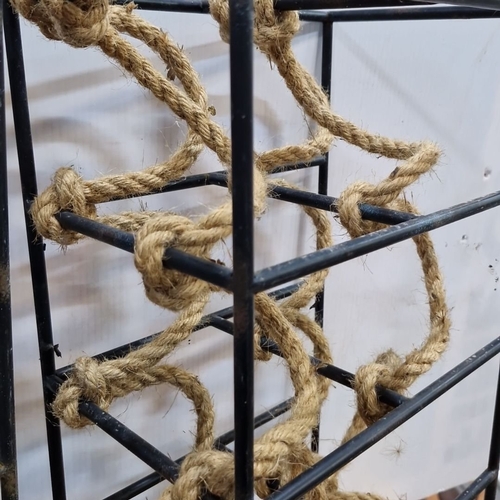 660 - Pair of industrial-style metal wine racks with decorative rope detail.