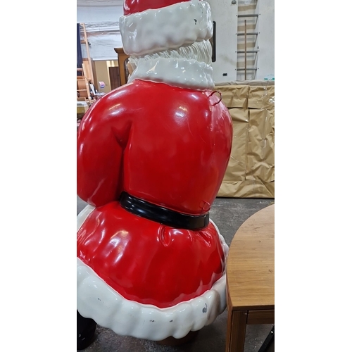 667 - Star lot : A huge 7 feet tall (sitting down ) Large painted Santa Claus figurine, red and white suit... 