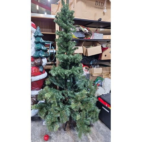 669 - Artificial Christmas tree with a spiral branch pattern. Includes a sturdy metal stand.