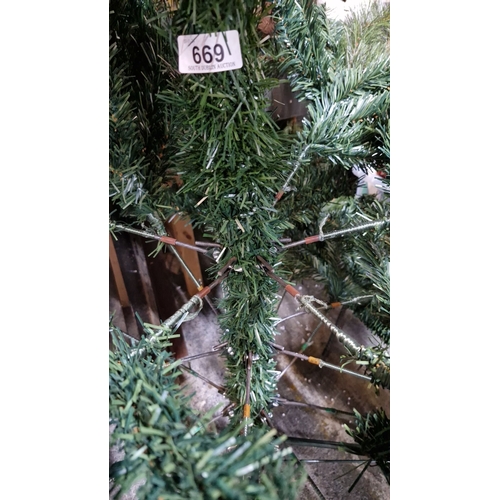 669 - Artificial Christmas tree with a spiral branch pattern. Includes a sturdy metal stand.