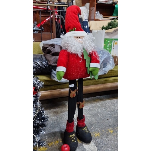 672 - Festive Approx 4 feet tall fabric Santa Claus figure features a plush beard, red outfit, and elongat... 