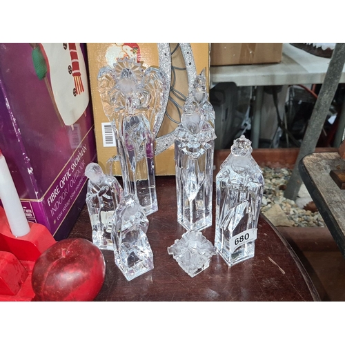 680 - Set of five crystal nativity figurines, featuring detailed frosted accents, including an angel, wise... 