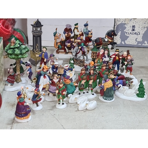 684 - Ceramic Christmas figurine collection depicts 