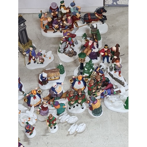 684 - Ceramic Christmas figurine collection depicts 