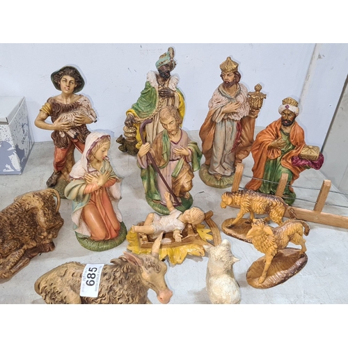 685 - Nativity set with hand-painted figurines including Mary, Joseph, Baby Jesus, Three Wise Men, shepher... 