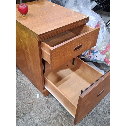 686 - Mid-Century Modern oak filing cabinet with two drawers and integrated handles.