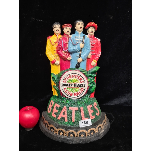 189 - A tall heavy cast metal Beatles, Fab 4 large door stop. Dressed up in costume as Sergent Peppers Lon... 