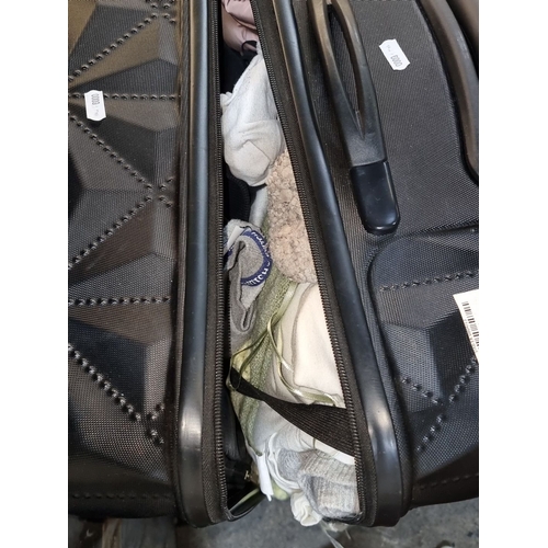 889 - Four unchecked lost luggage set includes two black, one brown, and one silver suitcase. Various size... 