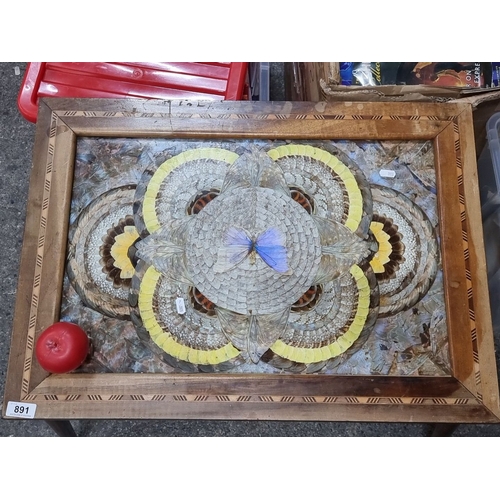 891 - Star lot :A Wooden inlaid table with intricate butterfly marquetry design, featuring a butterfly mot... 