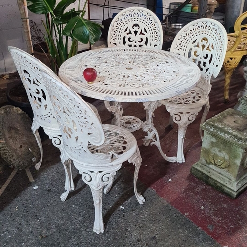 912 - Star lot :Victorian-style cast iron garden set, featuring intricate floral and scroll designs. Inclu... 