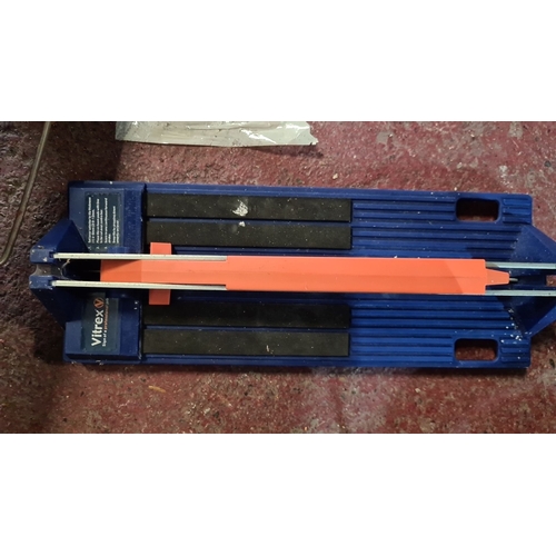 925 - Vitrex tile cutter in blue and orange, featuring a manual cutting mechanism. Sturdy steel frame with... 