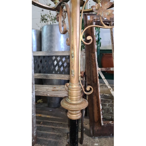 932 - Star lot.  An Antique wrought iron and brass church candelabra with ornate detailing and 12 candle h... 