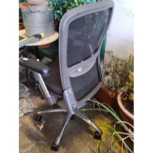 938 - Office chair with mesh back, adjustable armrests, and swivel base. Modern design. A good sturdy exam... 