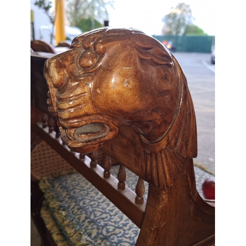 941 - Star lot : A lovely Pair of irish carved wooden armchairs featuring lion motifs,lion paw feet, caned... 