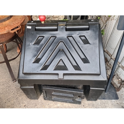 943 - A heavy black plastic coal bunker.