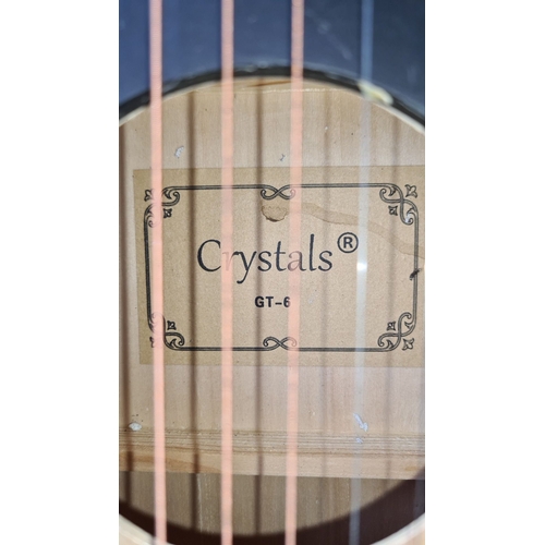 947 - Crystals GT-6 acoustic guitar features a decorative soundhole design and unique graphics.