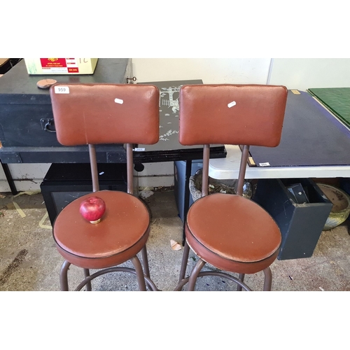 959 - Pair of vintage brown leather bar stools with metal frames, round seats, and backrests. Mid-century ... 