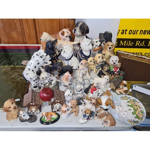 964 - Collection of ceramic dog figurines, various breeds, featuring detailed Dalmatian family figure. Tot... 