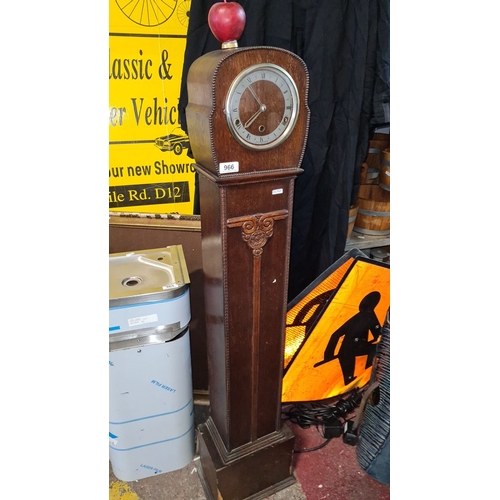 966 - Star lot :A 1940,s longcase grandmother clock in oak with decorative carvings and a domed top has a ... 