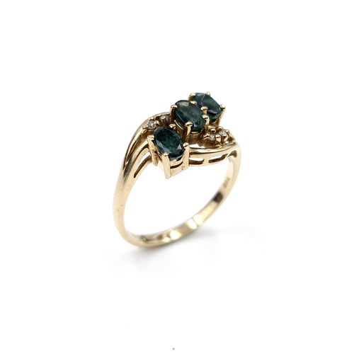 1075 - Star Lot : A stunning 9ct Gold ring with Emeralds and Diamonds. 
Size: M  Total weight: 2.9 g