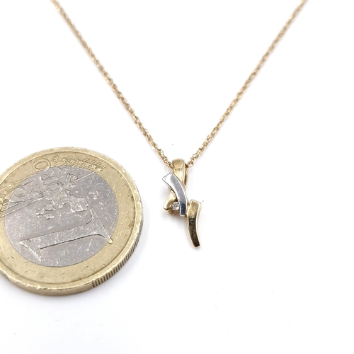 1076 - Star Lot : A lovely 9 ct white and yellow gold diamond necklace. Features a pendant with diamond. 
T... 