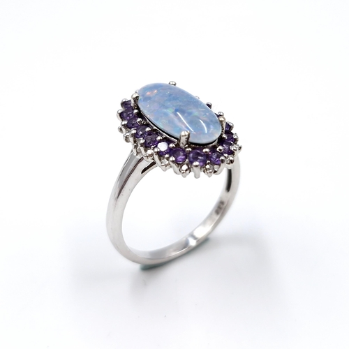 14 - A very pretty colour combination sterling silver ring set with opal cabochon stone with amethyst clu... 