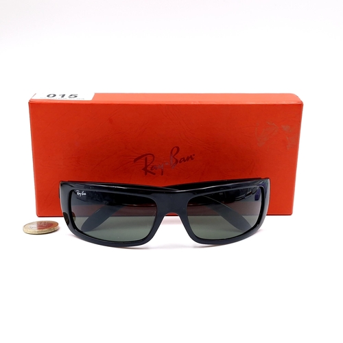 15 - A pair of wrap round Ray-Ban sunglasses 'Made in Italy'. Lenses clear . Comes in Ray-Ban box.