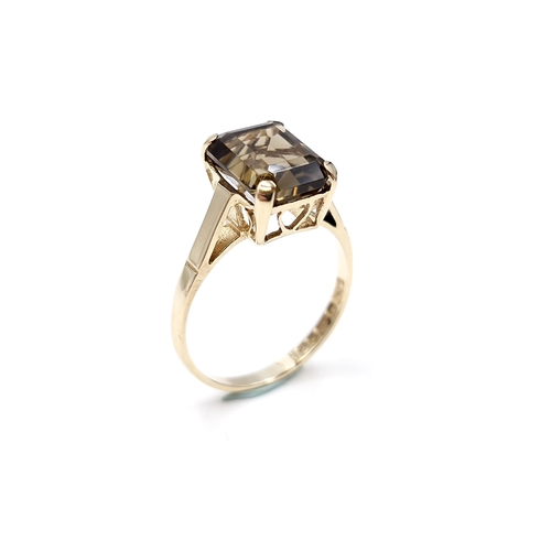 2 - A nine carat gold smoky quartz ring with claw mount. Size - M 1/2. Weight - 2.4 grams.