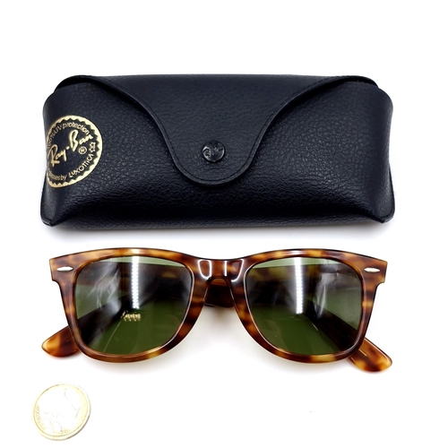 20 - A pair of Ray-Ban sunglasses marked USA set in faux tortoise shell frames. Wayfarer marked to frame.... 