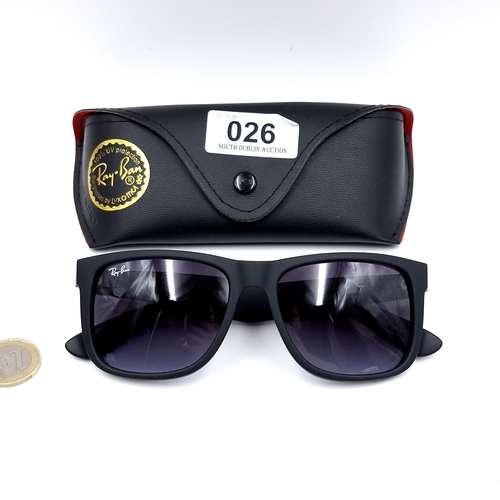 26 - A pair of Ray-Ban black framed sunglasses marked 'Made in Italy' with serial nos to frames. Lenses c... 