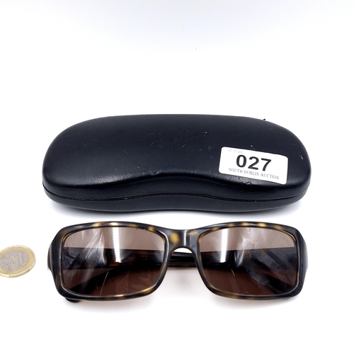 27 - A pair of Ray-Ban 'Made in Italy' faux tortoise shell sunglasses. Serial nos to frames. Lenses clear... 