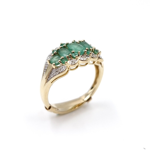 35 - Star Lot : A stunning five gemstone emerald ring with diamonds in 9ct gold . Ring size - P. Weight -... 