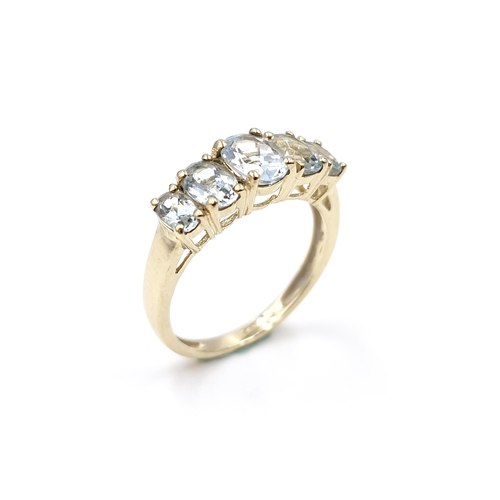 36 - Star Lot : A beautiful five stone graduated aquamarine ring set in nine carat gold. Ring size - O 1/... 