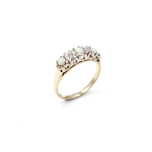 4 - Star Lot : A nine carat gold (375) opal and diamond set ring. Ring size - N. Weight - 2.35 grams.