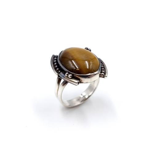 9 - An unusual heavy gents vintage tiger's eye stone ring. Size - R. Weight - 8.28 grams.