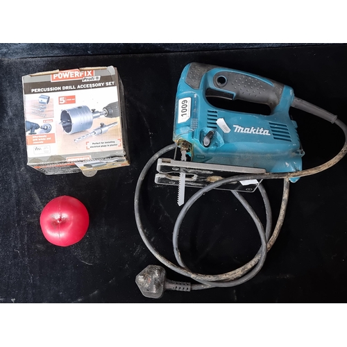 1009 - A lot featuring a Makita 4328 Variable Speed Jigsaw and a Powerfix Percussion Drill Accessory Set.