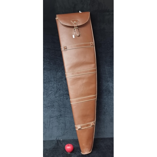 1012 - A vintage tanned leather shotgun case complete with buckle closure.