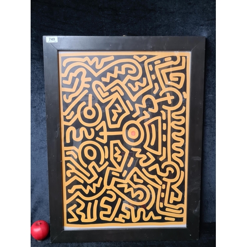 749 - A large print of a Keith Haring 'Playboy 1' screenprint poster. Housed in a black wooden frame behin... 