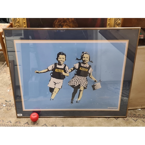 754 - A large print after an original Banksy titled 'Jack and Jill'. Signed in plate to lower right. House... 