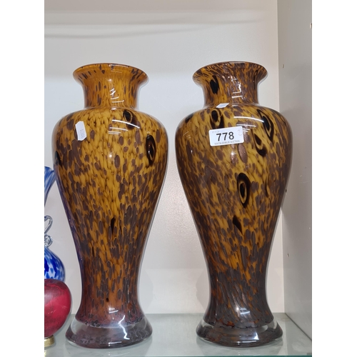 778 - A beautiful quality pair of tall hand blown vases in an amber tone with speckled detail.