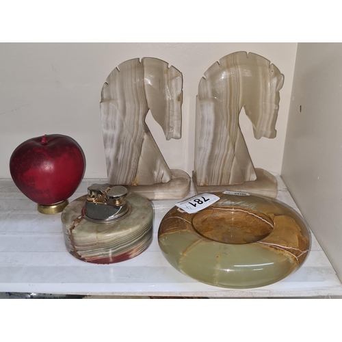 781 - Four 1930's Onyx items including a pair of horse themed bookends, a table lighter and an ashtray.