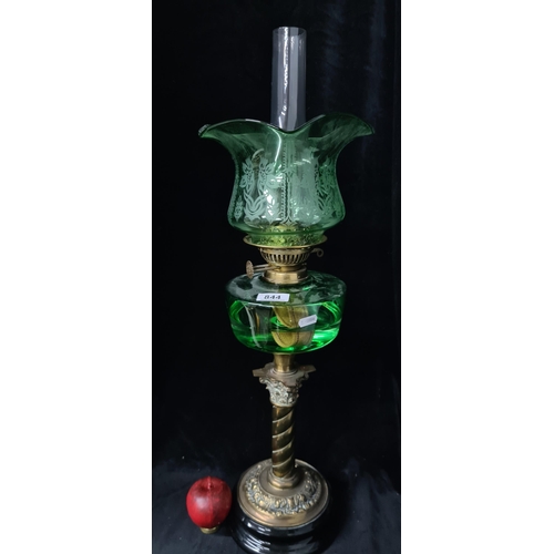 844 - Star lot : A stunning antique oil lamp boasting a beautiful barley twist column, emerald green reser... 