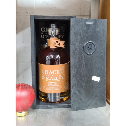 864 - A bottle of Grace O'Malley Rum cask finish batch 1 Irish Whiskey 70cl 42% with leather label and ori... 