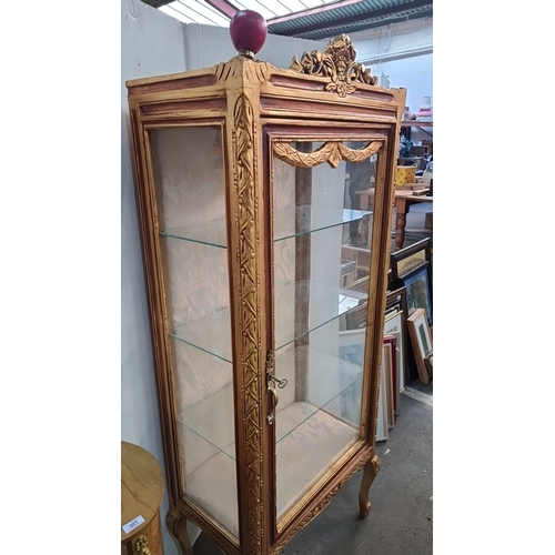 1154 - Star lot : A stunning Ornately carved gilt display cabinet with curved glass panels, rococo detailin... 